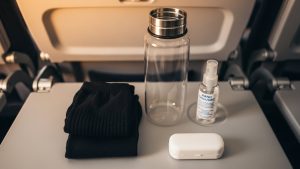 Packing compression socks and hydration gear is vital for knowing how to survive long-haul flights in economy.