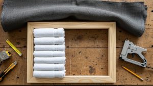 Building DIY panels with towels is a creative solution for how to soundproof a room cheaply.