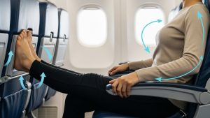 Performing seated exercises prevents stiffness while figuring out how to survive long-haul flights in economy.